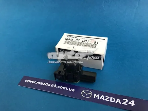 Sensor de aparcamiento trasero GMK667UC151 Mazda