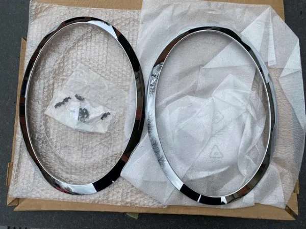 Tapa del faro izquierda 7300631 BMW